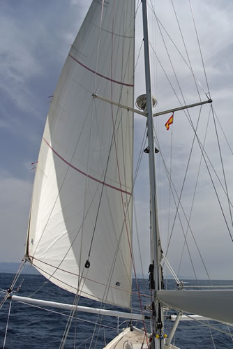 Sail area can be instantly halved by allowing the weather jib to fly to leeward